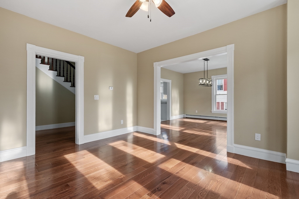 73 Cherry Street Gardner, MA 01440 - Photo 17 of 41 an empty room with wooden floor and mirror