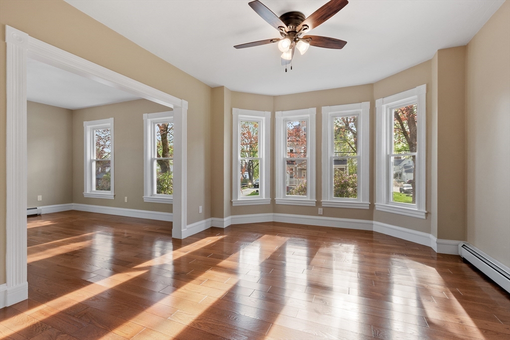 73 Cherry Street Gardner, MA 01440 - Photo 19 of 41 a view of an empty room with wooden floor and a window