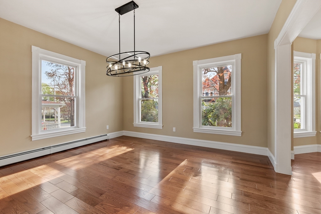 73 Cherry Street Gardner, MA 01440 - Photo 20 of 41 a view of an empty room with wooden floor and a window