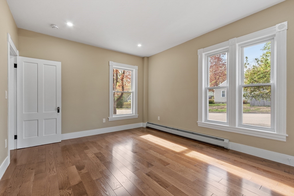 73 Cherry Street Gardner, MA 01440 - Photo 25 of 41 a view of an empty room with wooden floor and a window