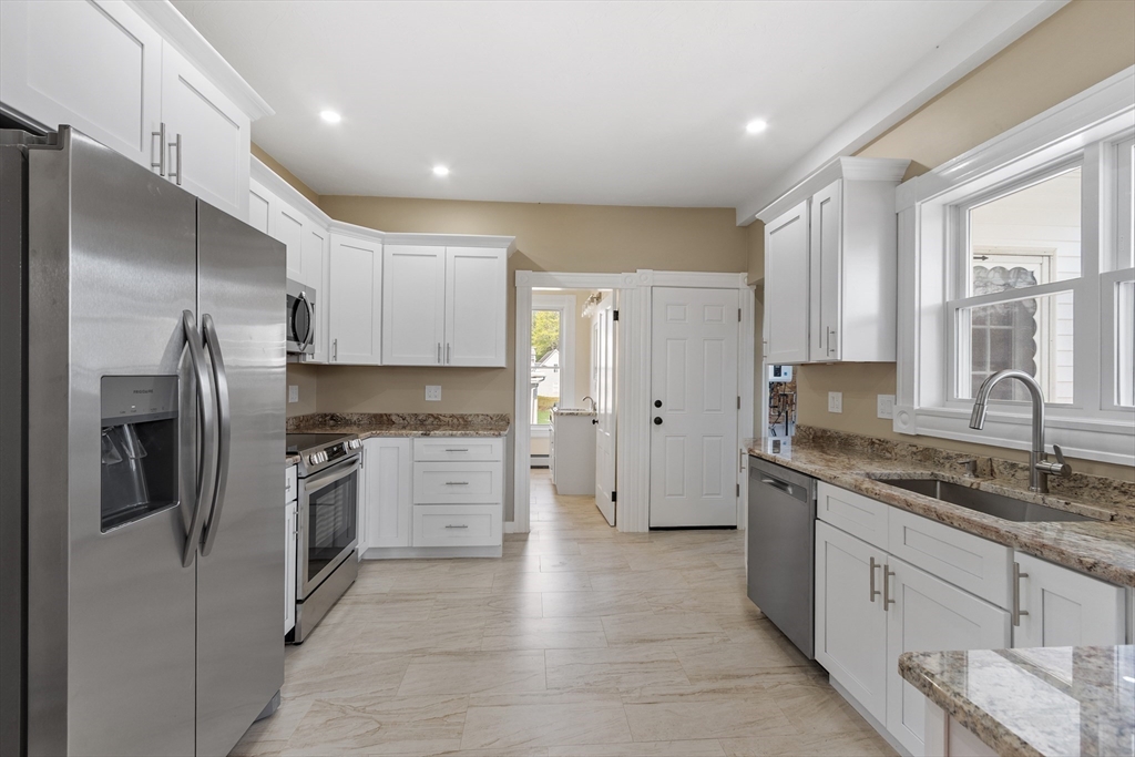 73 Cherry Street Gardner, MA 01440 - Photo 3 of 41 a kitchen with stainless steel appliances granite countertop a refrigerator and a sink