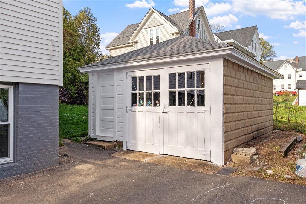 73 Cherry Street Gardner, MA 01440 - Photo 40 of 41 a view of a house with a yard and plants