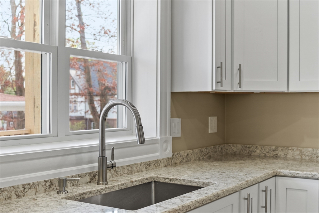 73 Cherry Street Gardner, MA 01440 - Photo 5 of 41 a kitchen with granite countertop a sink and a window