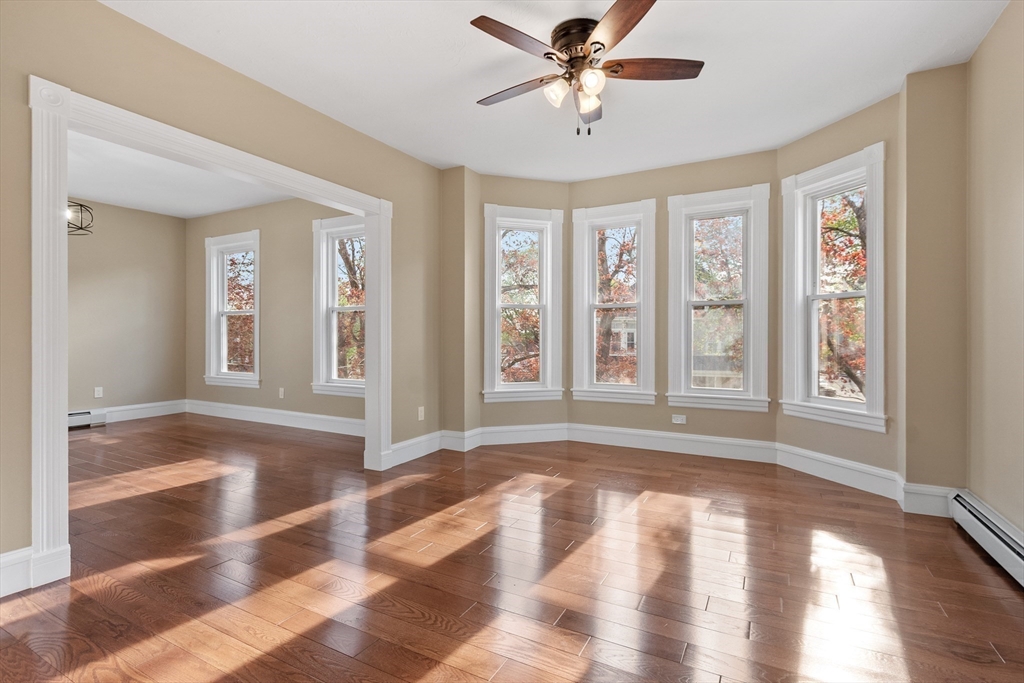 73 Cherry Street Gardner, MA 01440 - Photo 7 of 41 a view of an empty room with wooden floor and a window