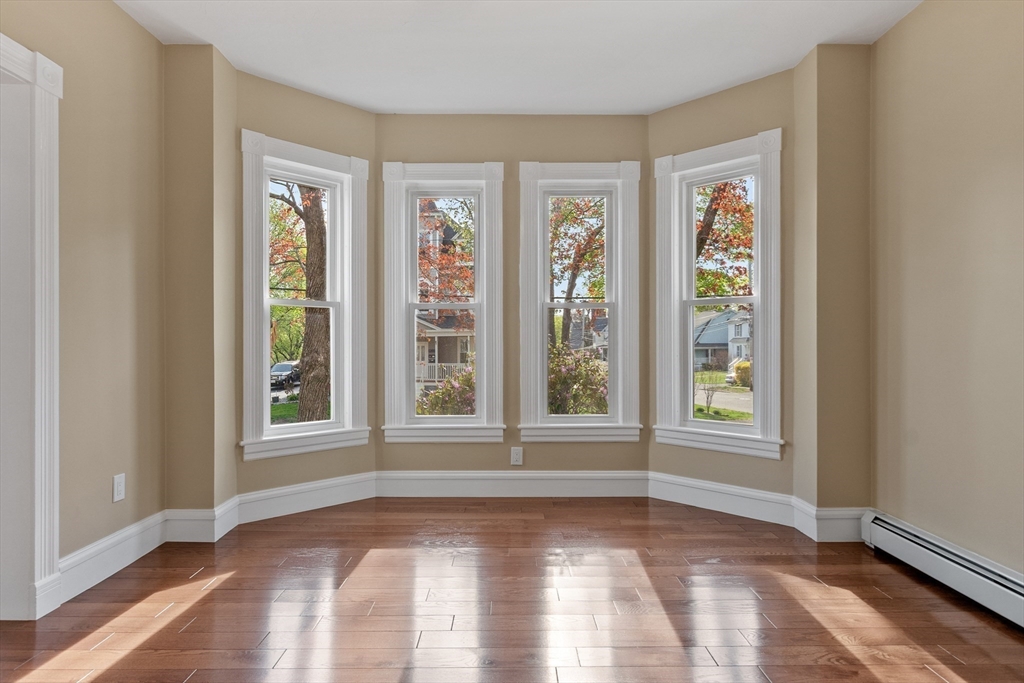 73 Cherry Street Gardner, MA 01440 - Photo 9 of 41 a view of an empty room with wooden floor and a window