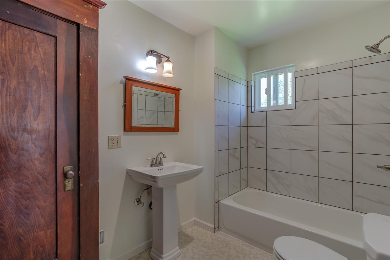 6110 Napa Road Corning, CA 96021 - Photo 31 of 62 a bathroom with a sink a toilet and bathtub