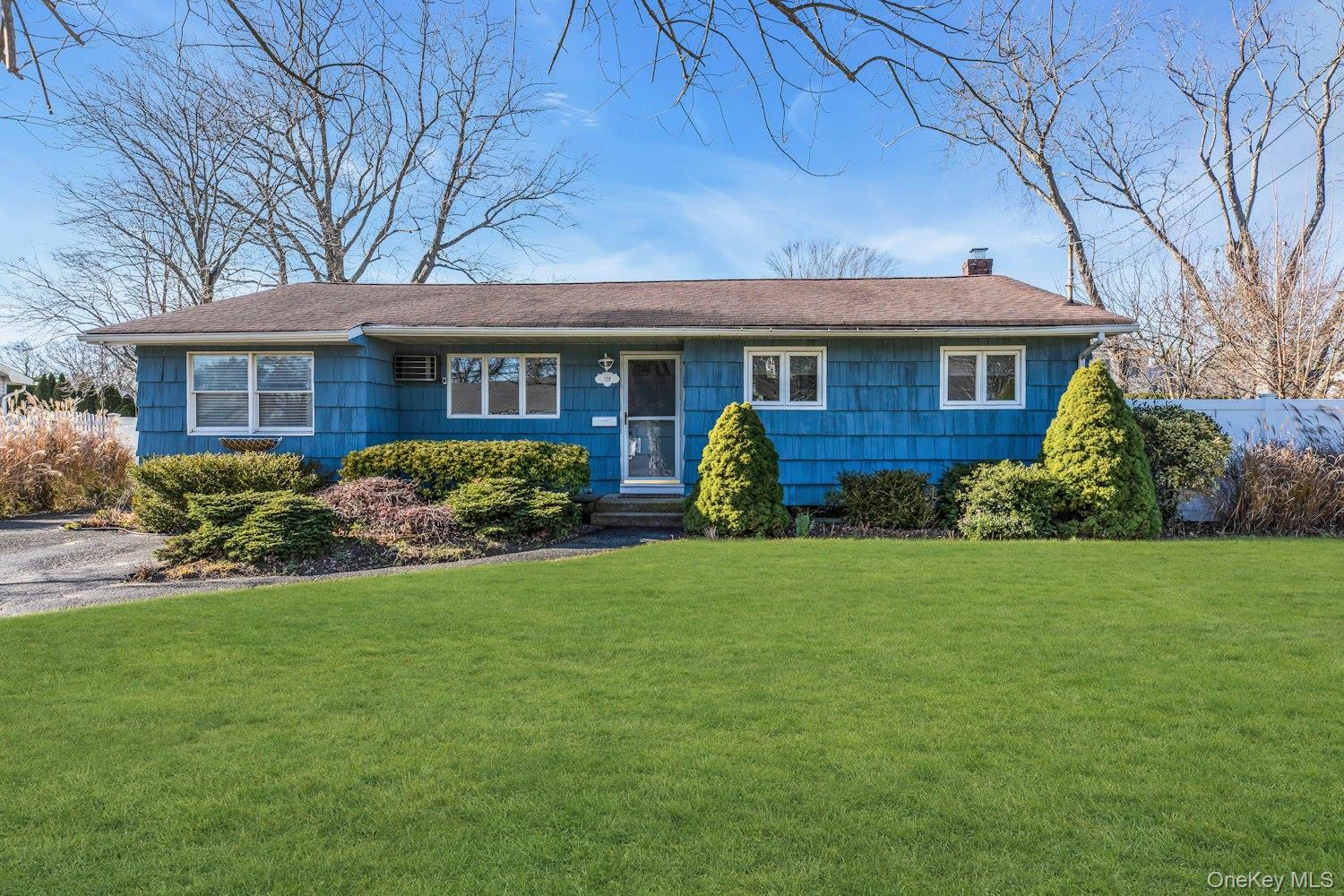 128 Wyandanch Road Sayville, NY 11782 - Photo 1 of 1 a front view of a house with garden