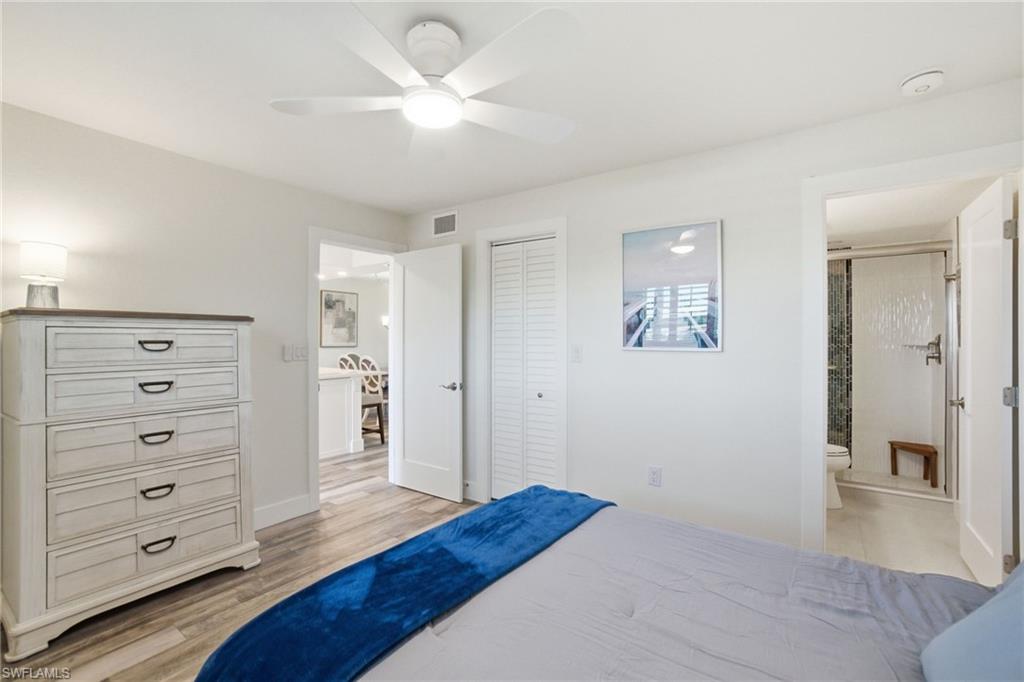 305 Goodlette-Frank Road, Unit C205 Naples, FL 34102 - Photo 14 of 26 Guest Bedroom with Ensuite Bathroom & Walk-in Closet