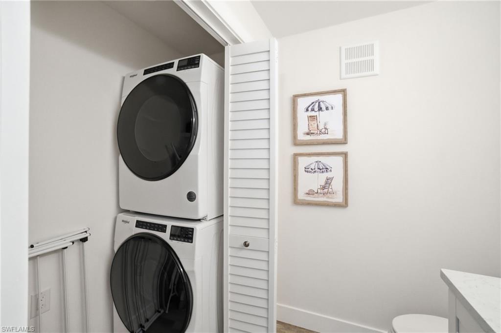 305 Goodlette-Frank Road, Unit C205 Naples, FL 34102 - Photo 17 of 26 Laundry attached to Half Bathroom with ample storage.