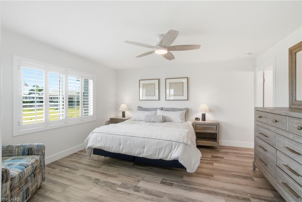 305 Goodlette-Frank Road, Unit C205 Naples, FL 34102 - Photo 9 of 26 Primary Bedroom with tons of natural light and views of the Gordon River