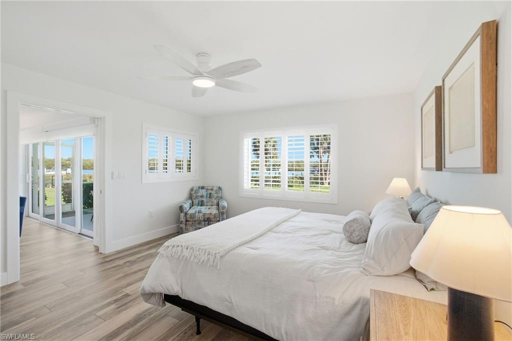 305 Goodlette-Frank Road, Unit C205 Naples, FL 34102 - Photo 10 of 26 Primary Bedroom with tons of natural light and views of the Gordon River