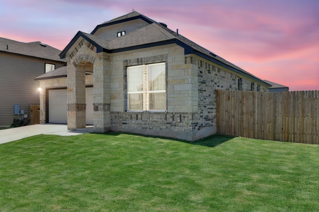 14516 Isidors Eagle Way Elgin, TX 78621 - Photo 21 of 21 a front view of a house with a yard
