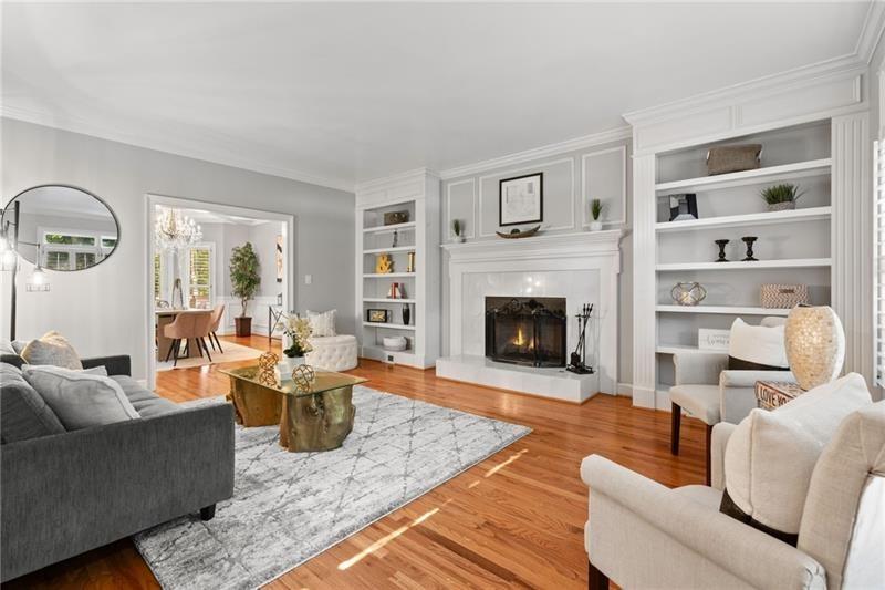 6030 Chimney Springs Road Buford, GA 30518 - Photo 11 of 110 a living room with furniture and a fireplace