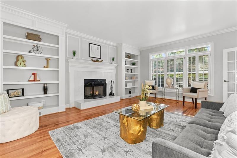 6030 Chimney Springs Road Buford, GA 30518 - Photo 12 of 110 a living room with furniture large window and a fireplace