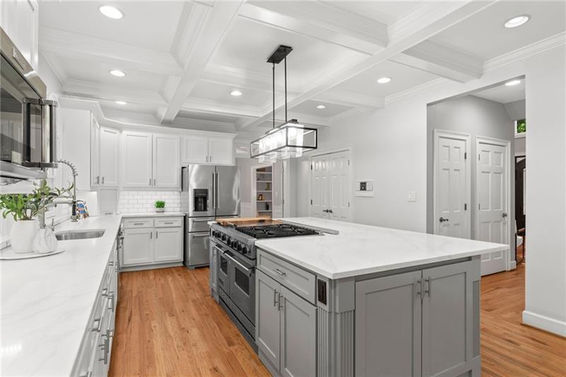 6030 Chimney Springs Road Buford, GA 30518 - Photo 24 of 110 a kitchen that has a lot of cabinets in it
