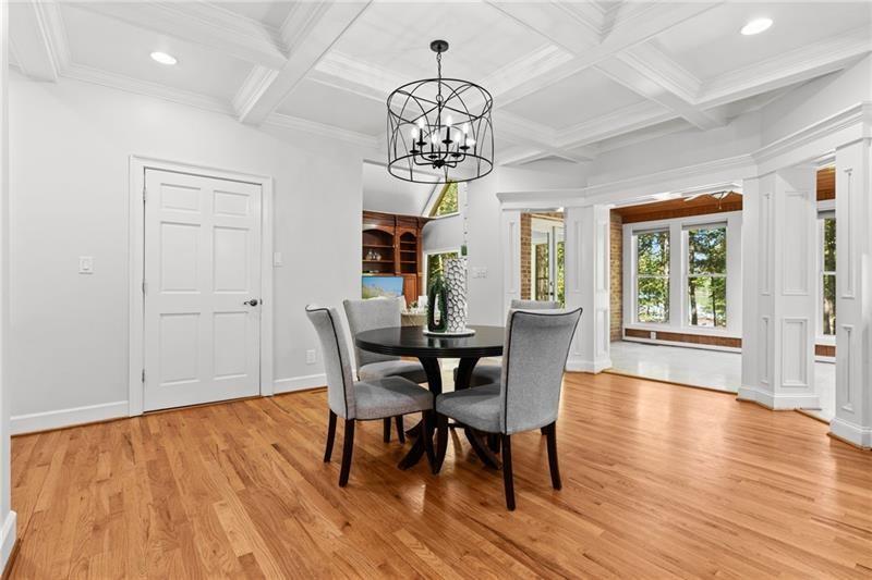 6030 Chimney Springs Road Buford, GA 30518 - Photo 28 of 110 a view of a dining room with furniture window and wooden floor