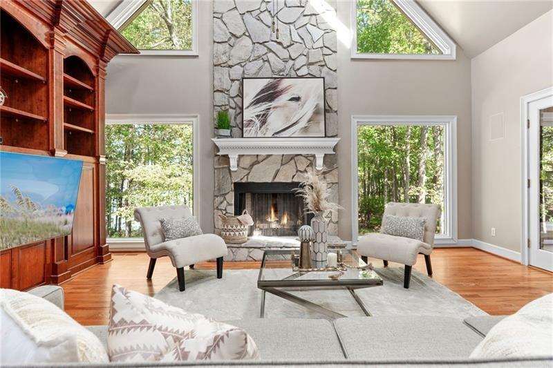 6030 Chimney Springs Road Buford, GA 30518 - Photo 32 of 110 a living room with furniture and a fireplace
