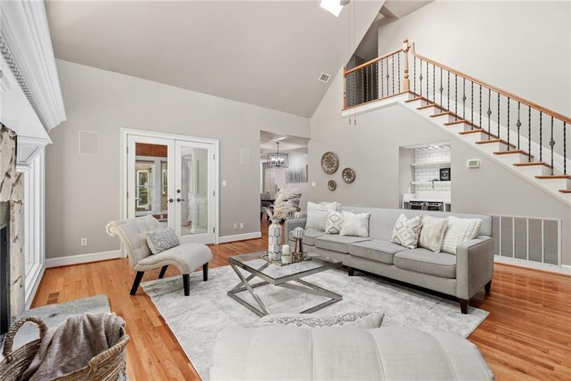 6030 Chimney Springs Road Buford, GA 30518 - Photo 34 of 110 a living room with furniture or couch and a table