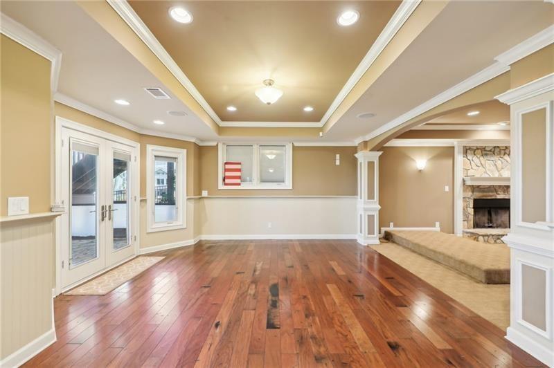 6030 Chimney Springs Road Buford, GA 30518 - Photo 73 of 110 a view of an empty room with wooden floor and a window