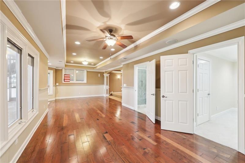 6030 Chimney Springs Road Buford, GA 30518 - Photo 74 of 110 a view of an empty room with wooden floor and a window