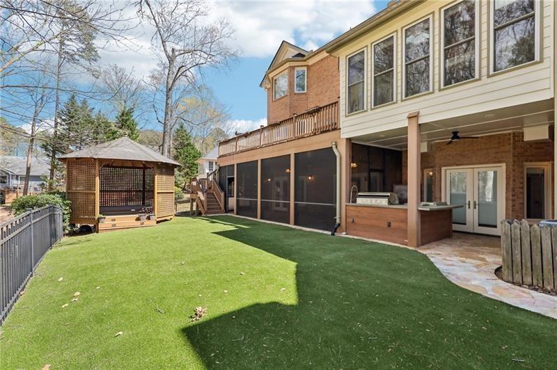 6030 Chimney Springs Road Buford, GA 30518 - Photo 92 of 110 a view of a house with a yard and sitting area