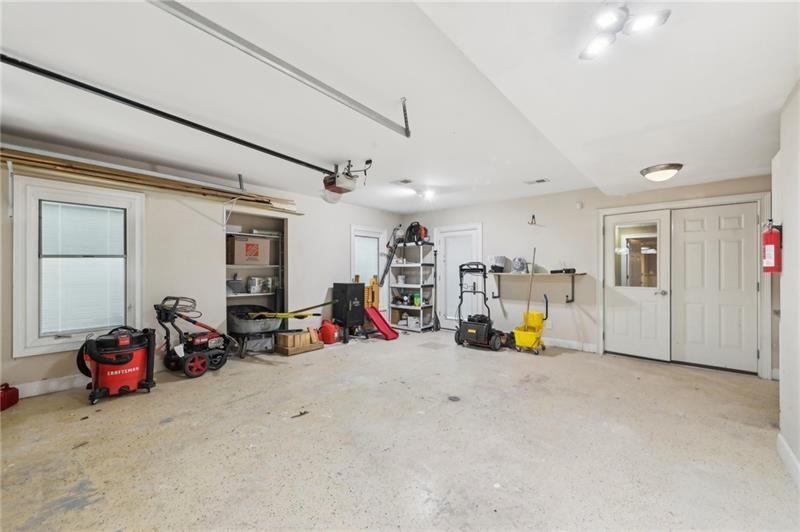 6030 Chimney Springs Road Buford, GA 30518 - Photo 99 of 110 a view of a garage with gym equipment