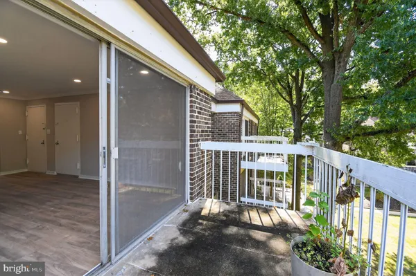 a view of a balcony with wooden floor