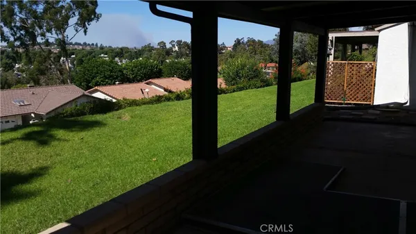 a view of a porch and garden