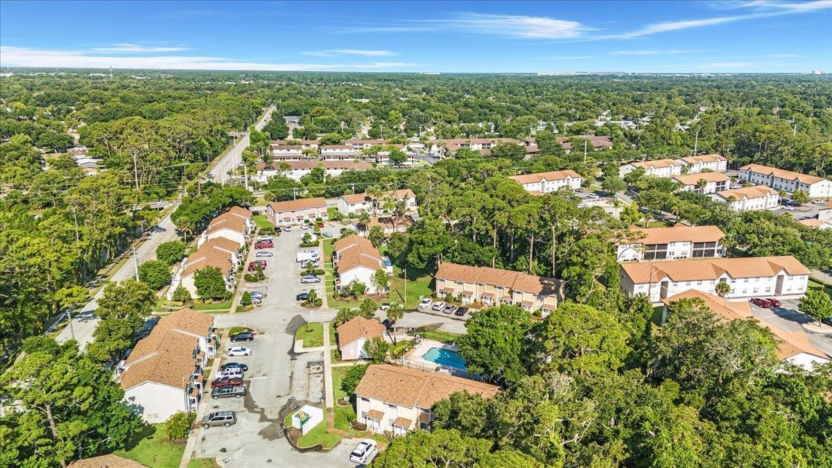 480 Reed Canal Road, Unit 16 Daytona Beach, FL 32119 - Photo 28 of 31 an aerial view of residential houses with outdoor space