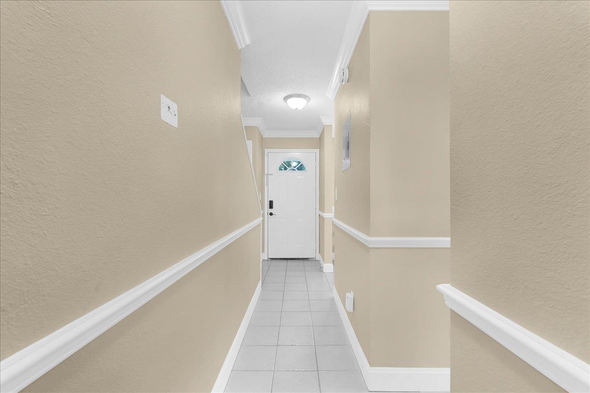 480 Reed Canal Road, Unit 16 Daytona Beach, FL 32119 - Photo 4 of 31 a view of hallway with stairs