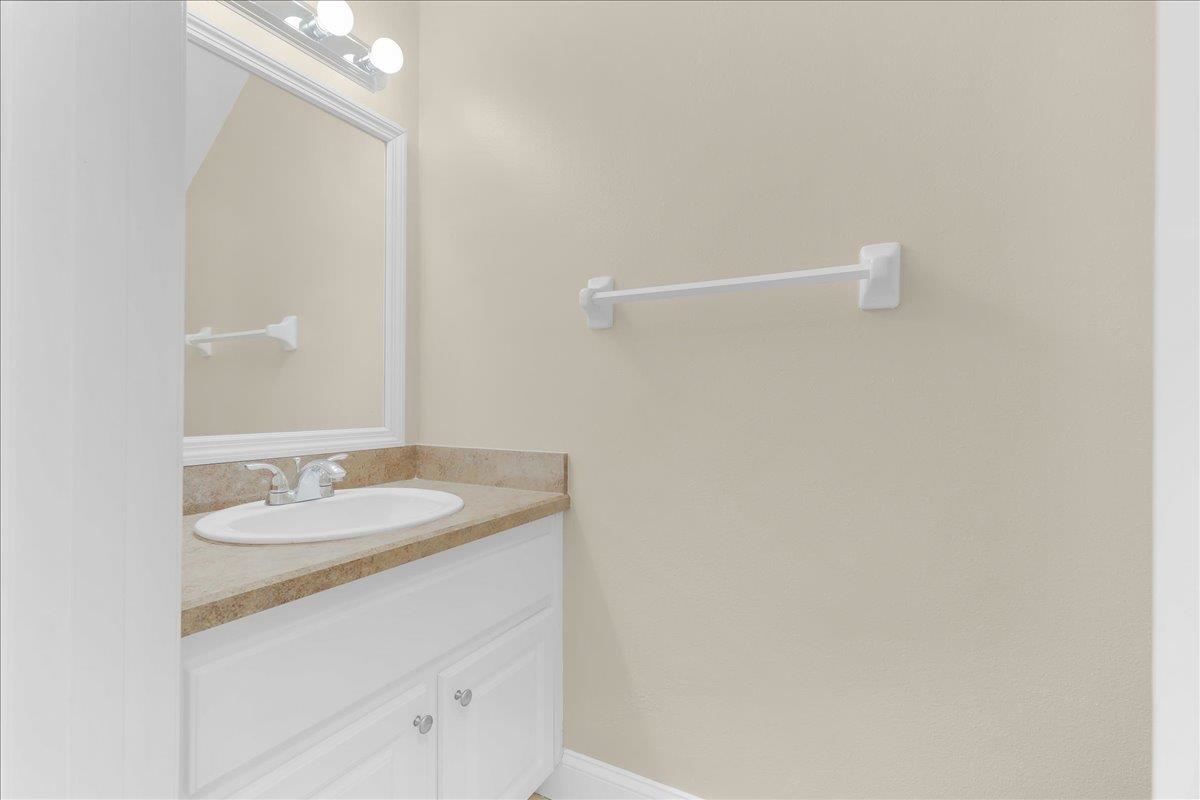 480 Reed Canal Road, Unit 16 Daytona Beach, FL 32119 - Photo 5 of 31 a bathroom with a sink and a mirror