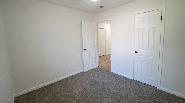 a view of hallway with closet