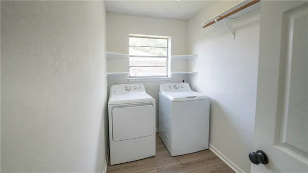 a utility room with dryer and washer