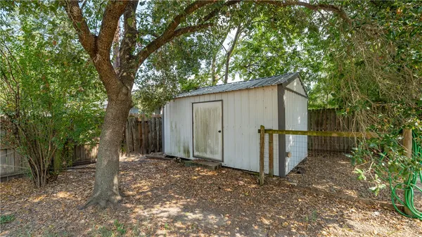 a backyard of a house with shaded area