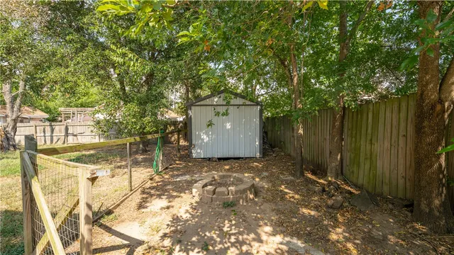 a view of small yard with swimming pool