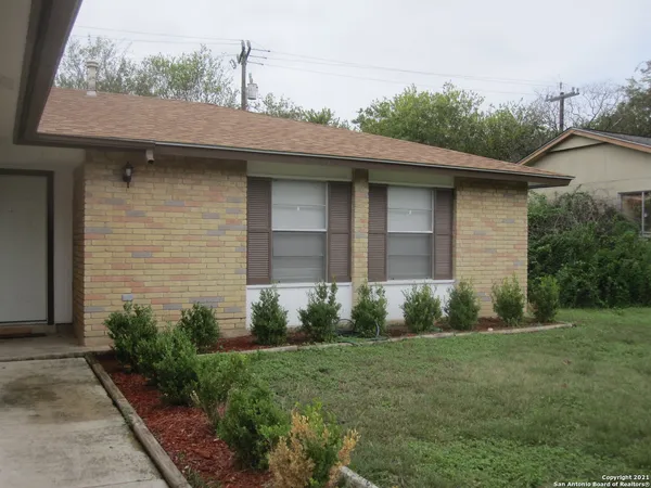 a brick house with a yard
