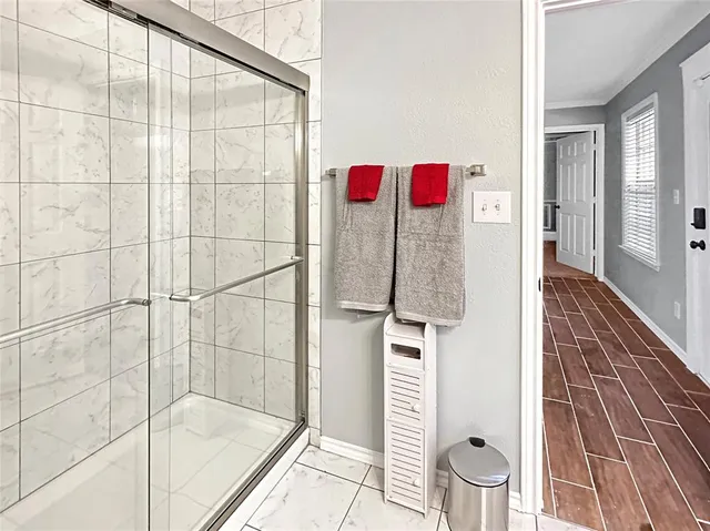 a bathroom with a bathtub and shower