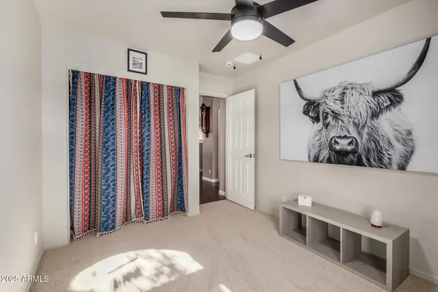 a view of a hallway with workspace and a window