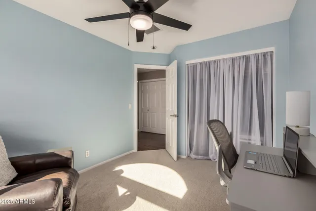 a bedroom with a bed and a couch