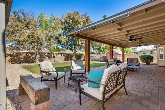 a view of a patio with a table chairs and a patio
