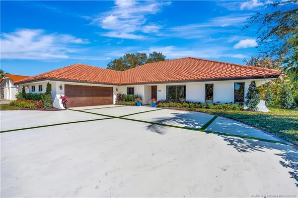 a front view of a house with a garage