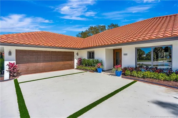 a house with a garden in front of it