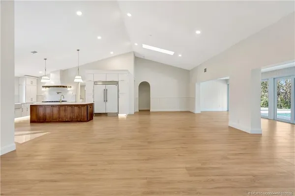 a kitchen with a cabinets and a stove top oven