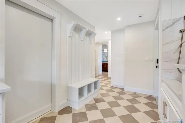 a view of walk in closet with wooden floor