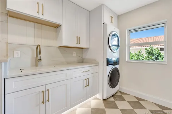 a view of walk in closet with wooden floor