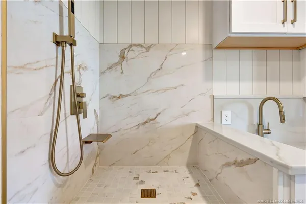 a bathroom with a double vanity sink mirror and toilet