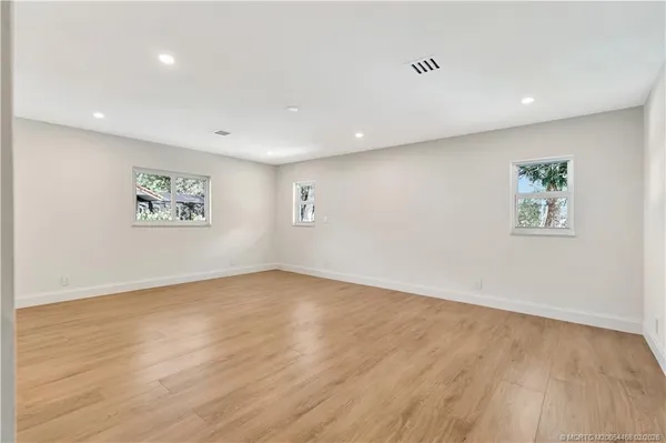 a view of house with backyard space and balcony