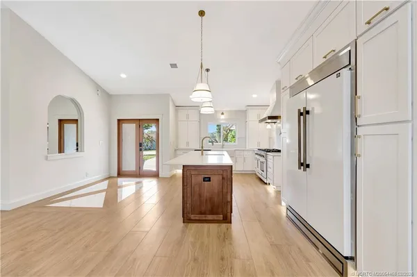 a kitchen with a stove and a sink