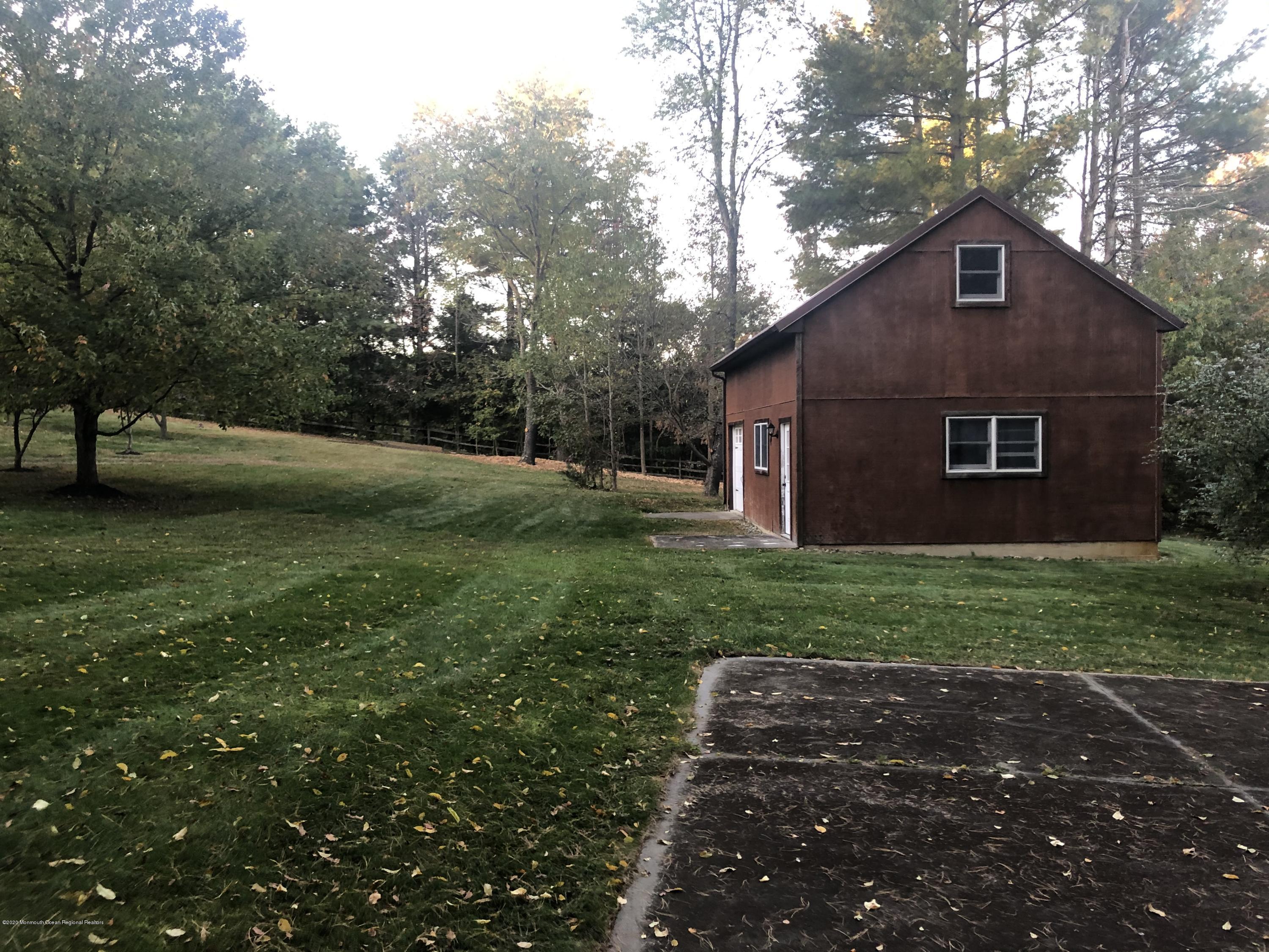 88 Millstone Road Millstone Township, NJ 08535 - Photo 32 of 41 Basketball court & barn
