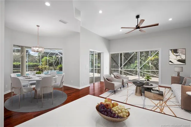 a bathroom with a granite countertop sink a toilet and a mirror